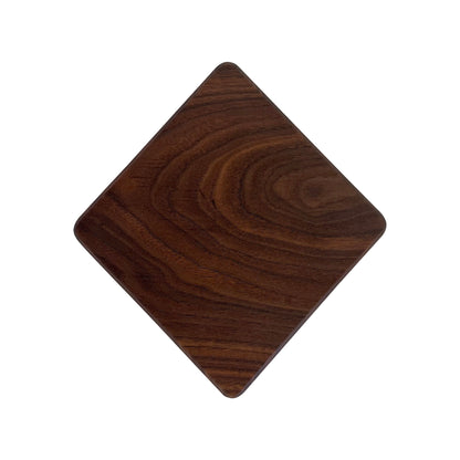 Diamond-shaped charcuterie board made from sustainably sourced American walnut with a food-safe finish and beveled edges, ideal for stylishly serving meats, cheeses, fruits, or desserts.