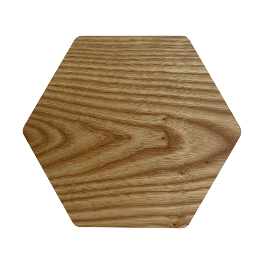 Hexagon-shaped charcuterie board made from sustainably sourced American walnut with a food-safe finish and beveled edges, offering a modern, geometric serving surface for meats, cheeses, fruits, or desserts.