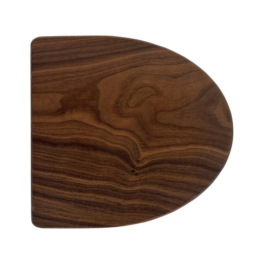 Letter D-shaped charcuterie board made from sustainably sourced American walnut with a food-safe finish and beveled edges, perfect for serving meats, cheeses, fruits, or desserts at personalized gatherings or initial-themed events.