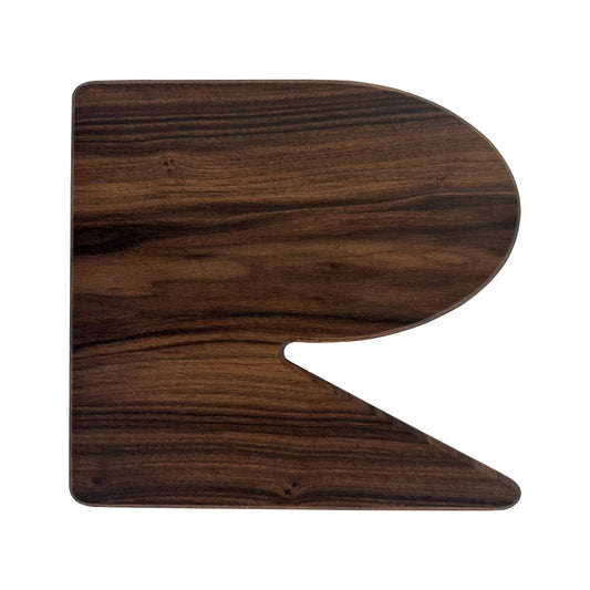 Letter R-shaped charcuterie board made from sustainably sourced American walnut with a food-safe finish and beveled edges, perfect for serving meats, cheeses, fruits, or desserts at personalized gatherings or initial-themed events.