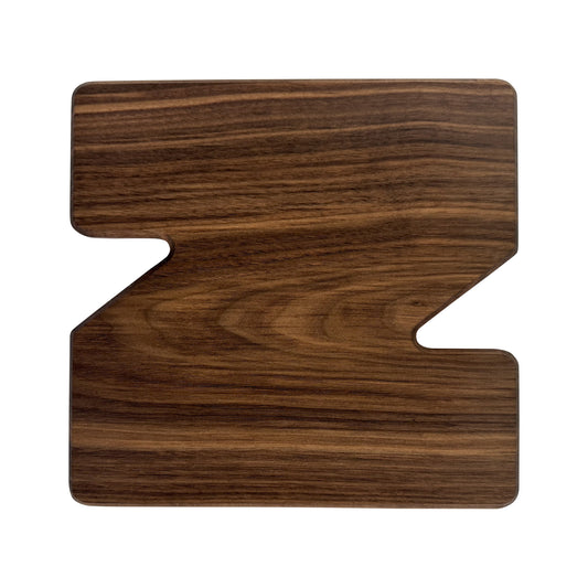 Letter Z-shaped charcuterie board made from sustainably sourced American walnut with a food-safe finish and beveled edges, perfect for serving meats, cheeses, fruits, or desserts at personalized gatherings or initial-themed events.